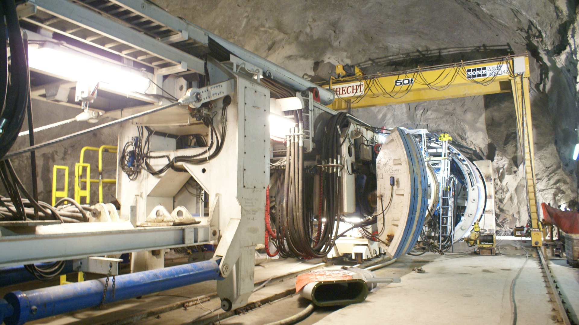 Tunnel construction equipment operating inside an underground excavation